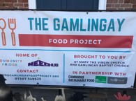 A banner placed outside the Gamlingay Food Project, listing the scheme's organisers