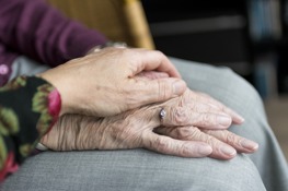 Two people holding hands